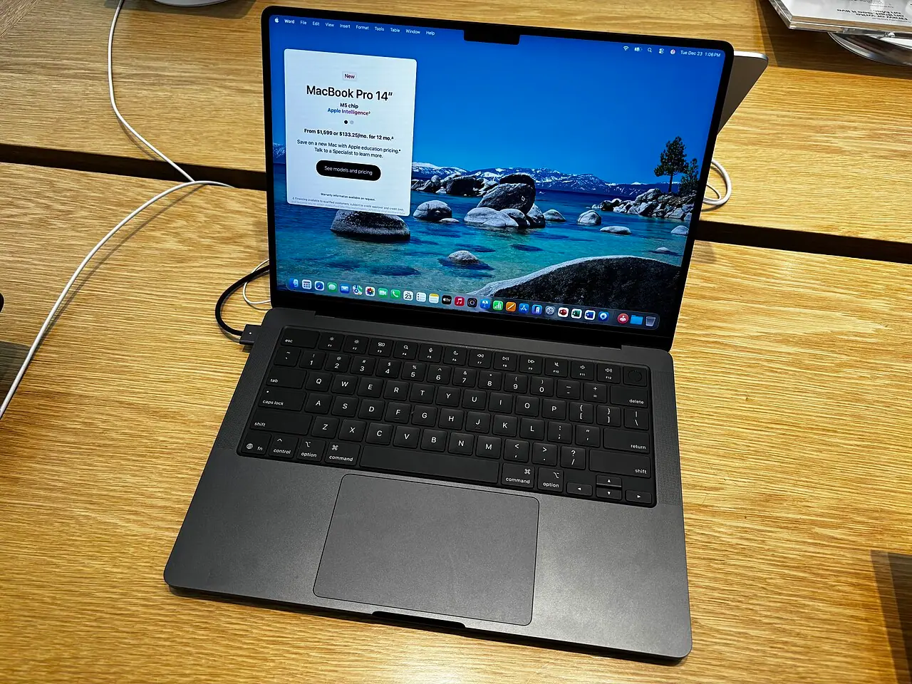 Top view of a 14-inch M5 MacBook Pro in Space Black running macOS (Wikimedia Commons, CC0)—matches the Apple silicon hardware class at the centre of kernel-exploit reporting; not Anthropic’s Calif lab bench, Mythos scorecards, or Apple’s own CVE web layout.