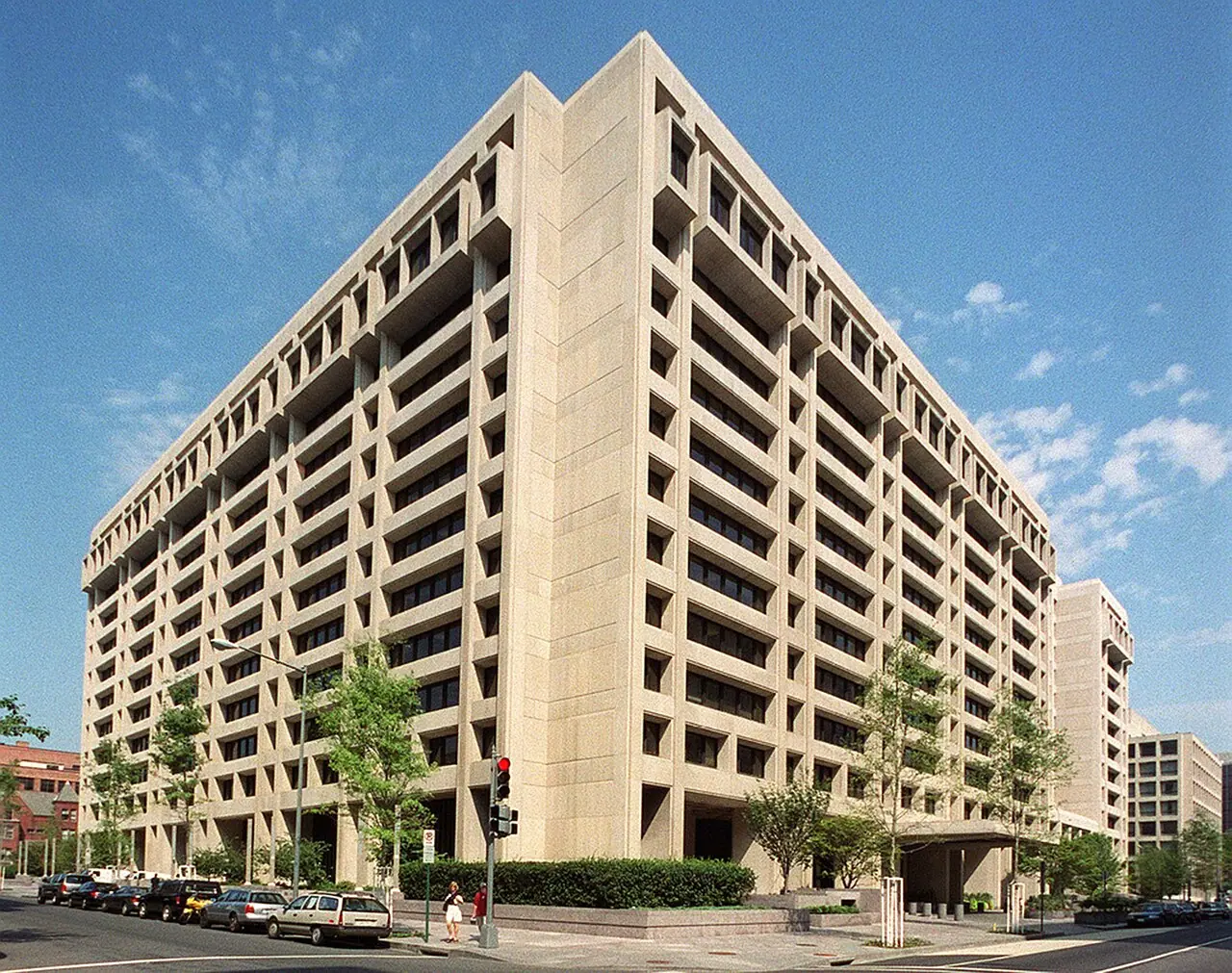 International Monetary Fund headquarters building in Washington, D.C. (Wikimedia Commons)—institutional context for the 2026 Article IV mission text on the United Kingdom discussed in the story; not a Downing Street photograph, ONS chart, or live market screen.