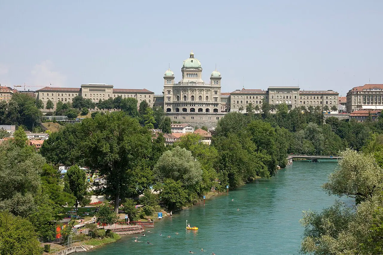 The Federal Palace (Bundeshaus) in Bern, seat of the Swiss federal government—Wikimedia Commons exterior used here as institutional context for federal intelligence and archive policy, not a photograph of Mengele or any classified file page.